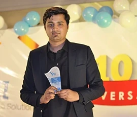 Vizz Web Solutions employee receiving an award for outstanding performance and contributions